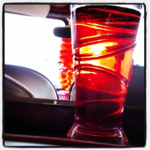 Pint of cider inside a split screen camper van